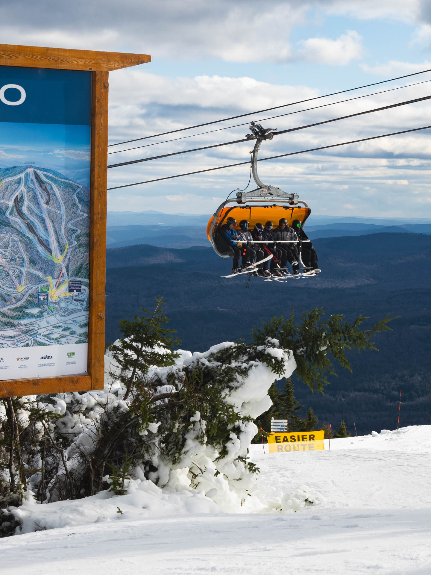 Chairlift riders heading up the mountain